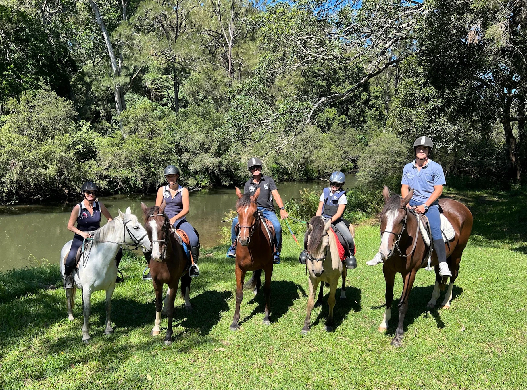 Riders on the riverbank