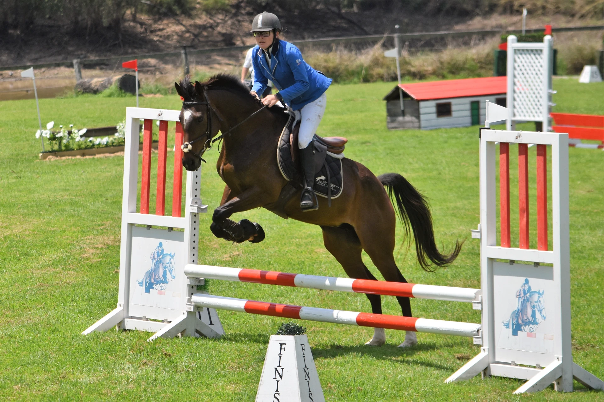 A rider jumping at an outside competition