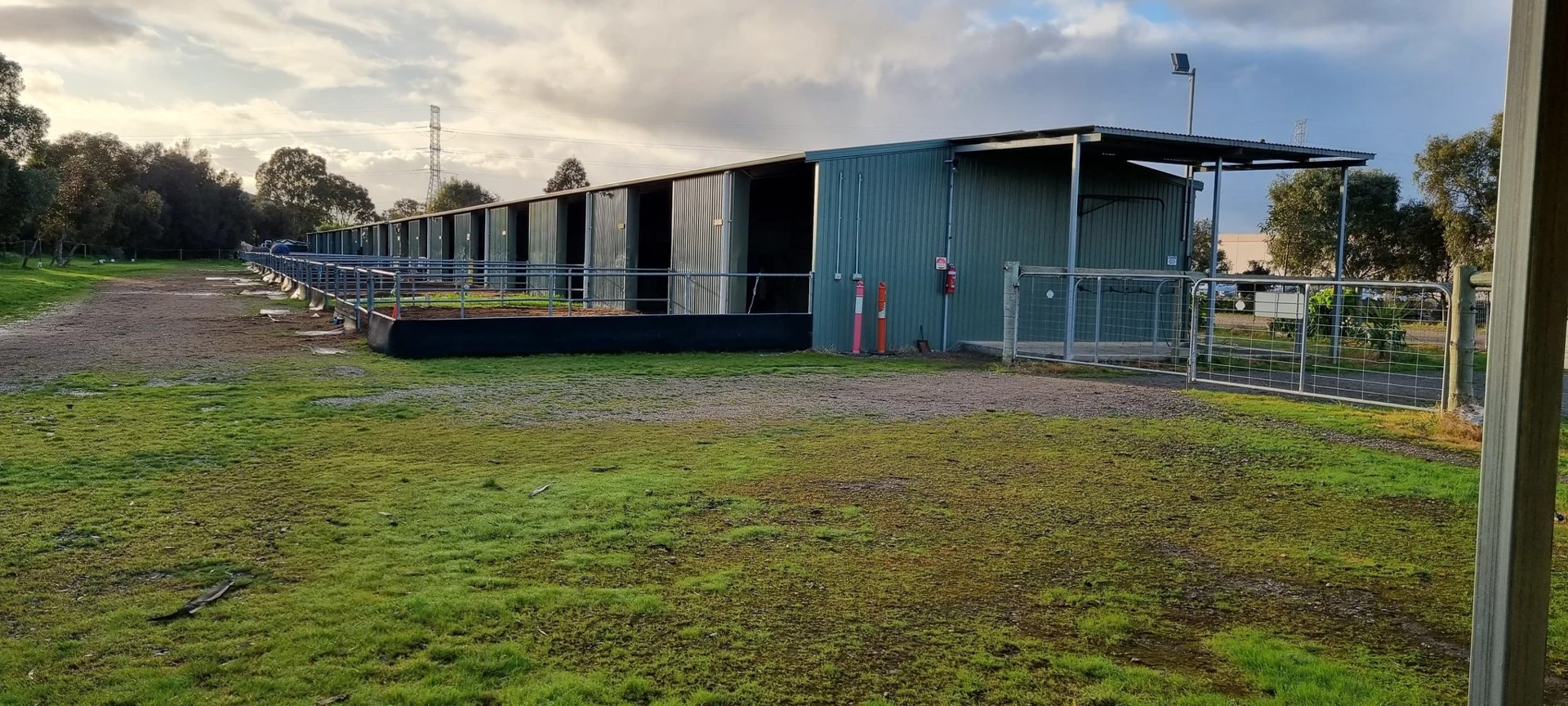 Steel stables with open yards and tack sheds