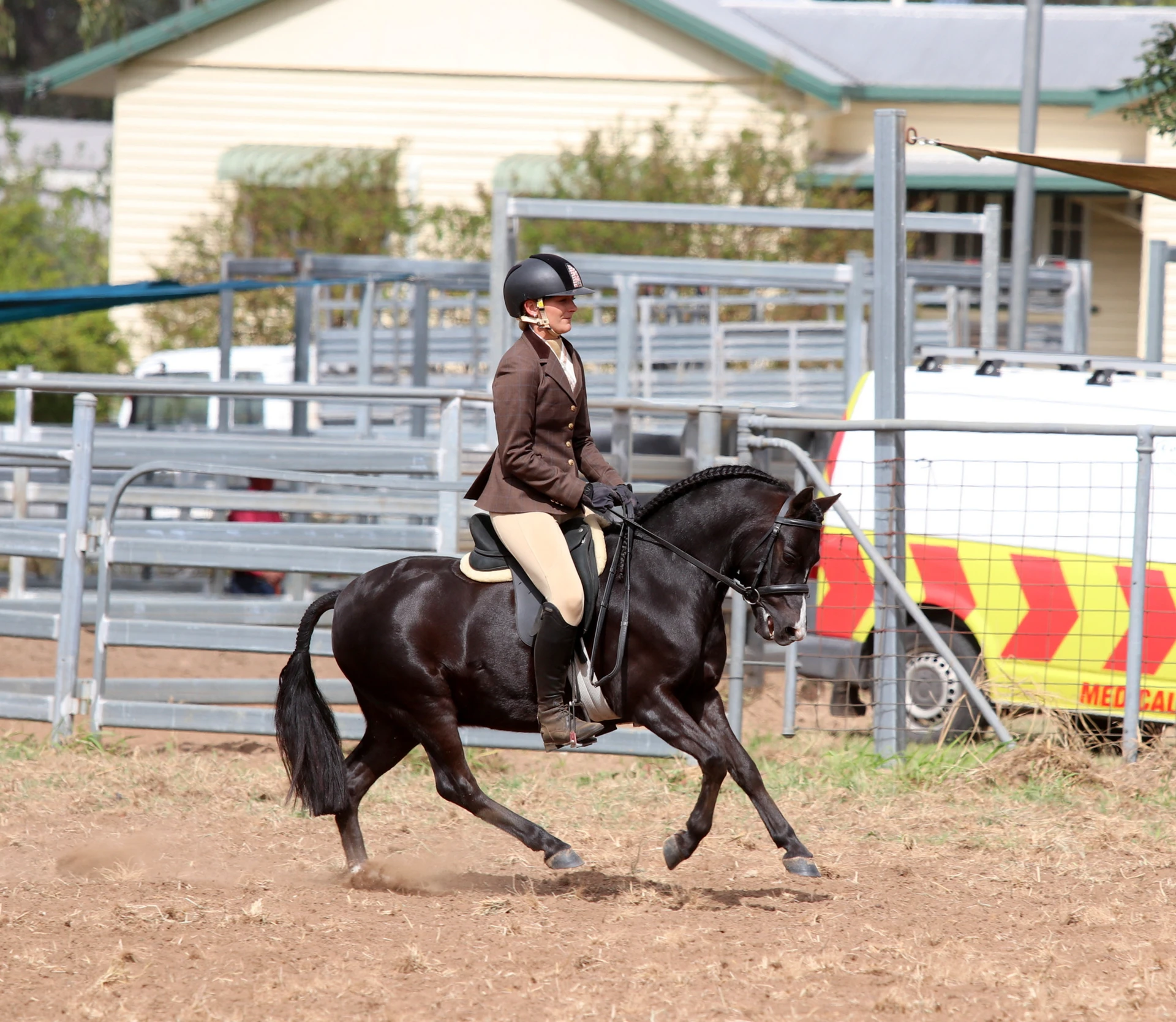 Pony and rider cantering