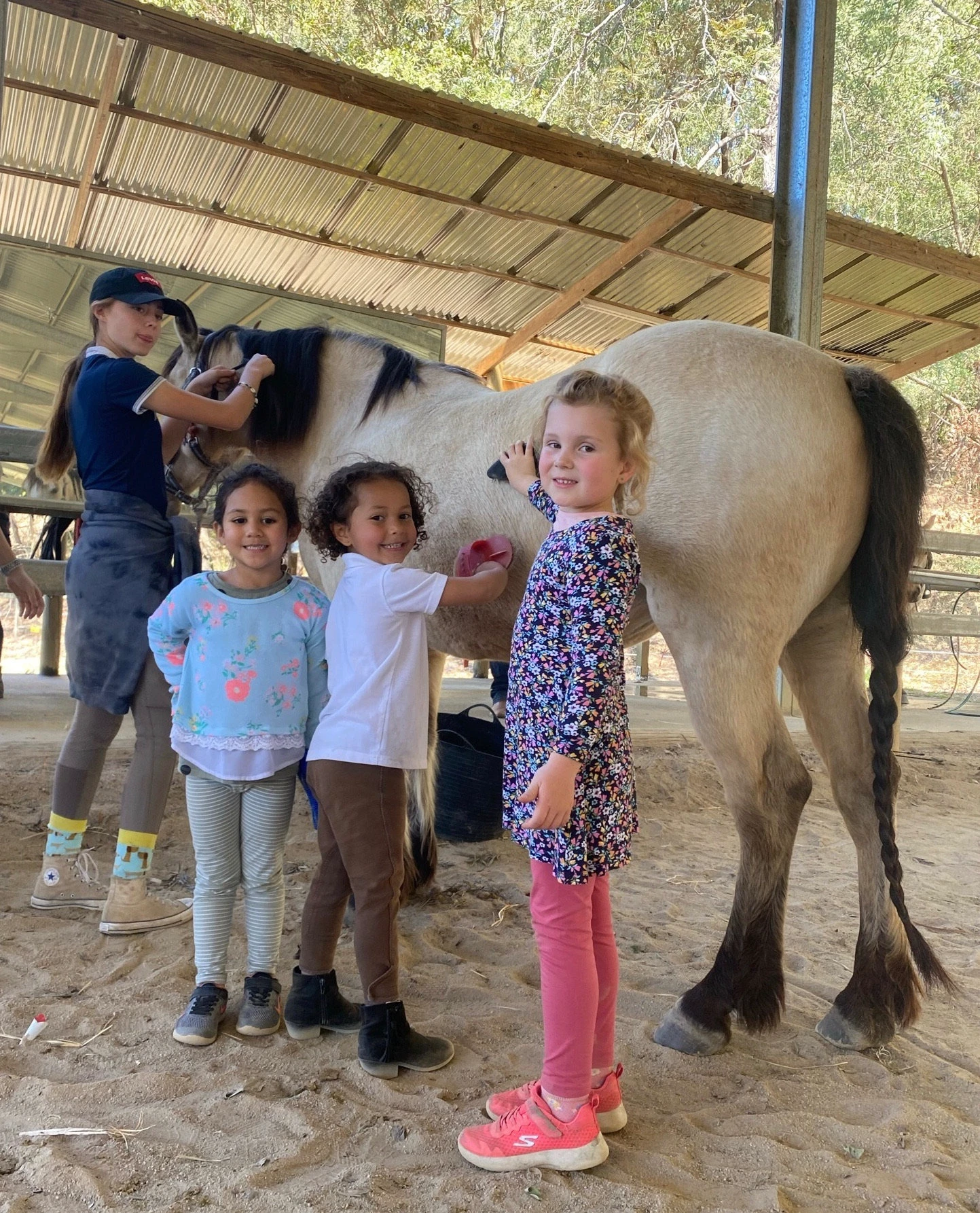 Children patting a pony at a party