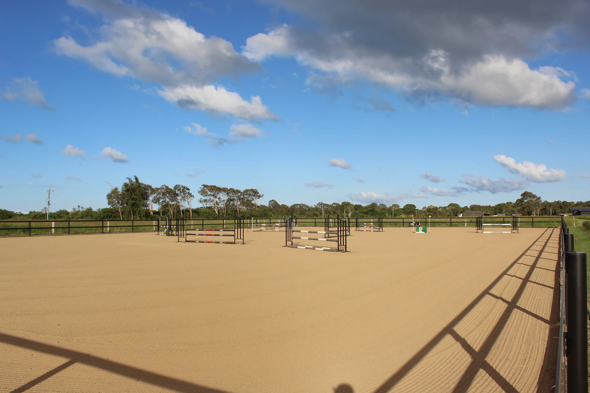 A jump course set in the sand arena
