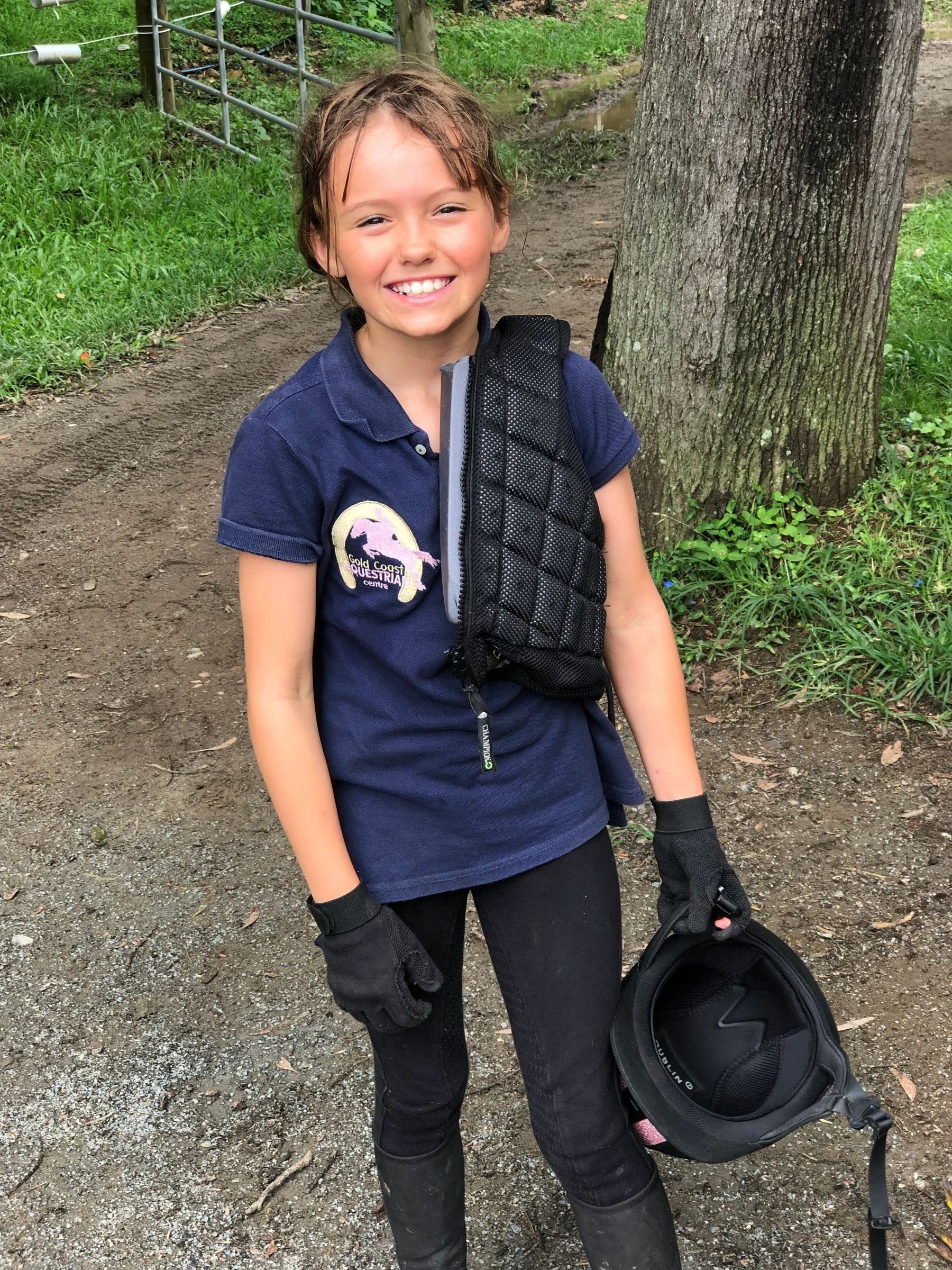 A young rider in her body protector