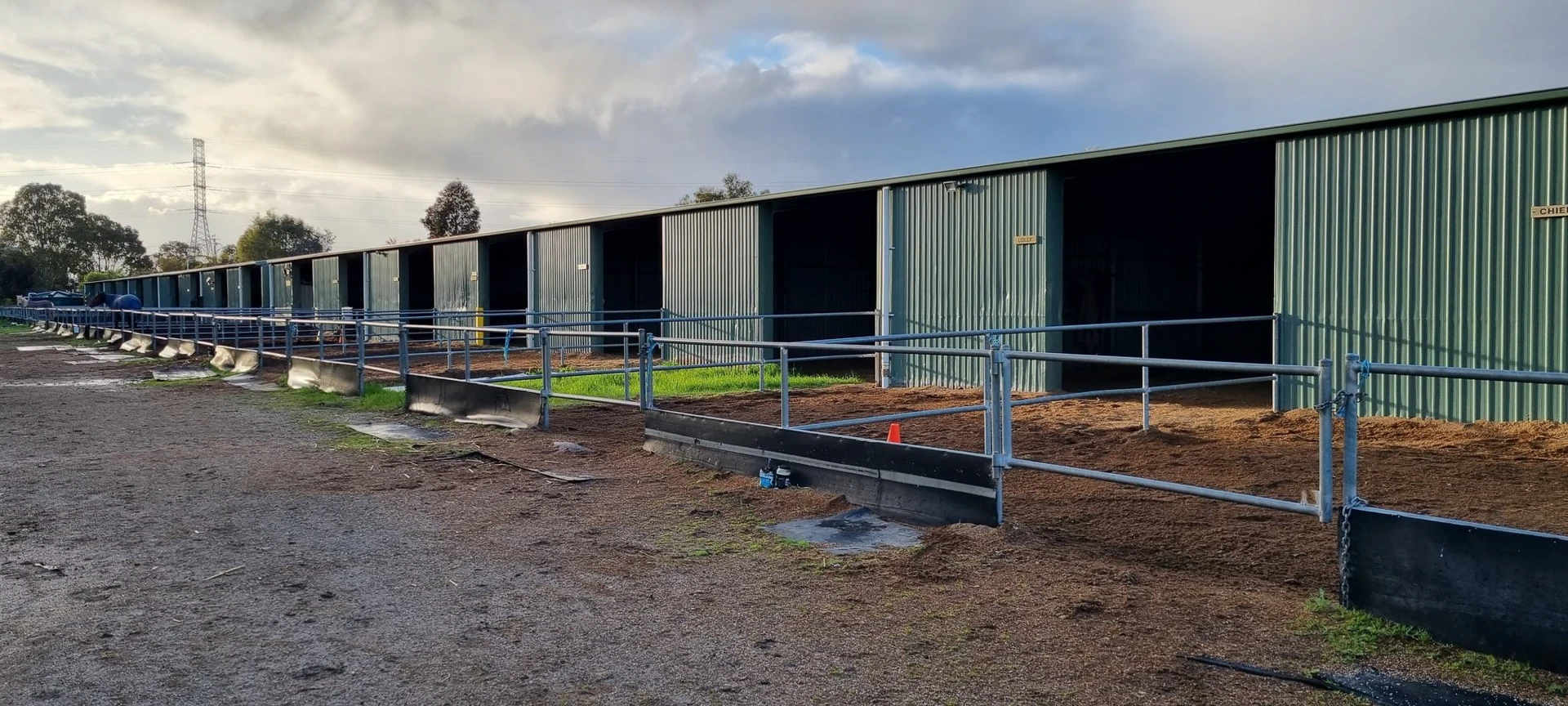 Row of stables with yards