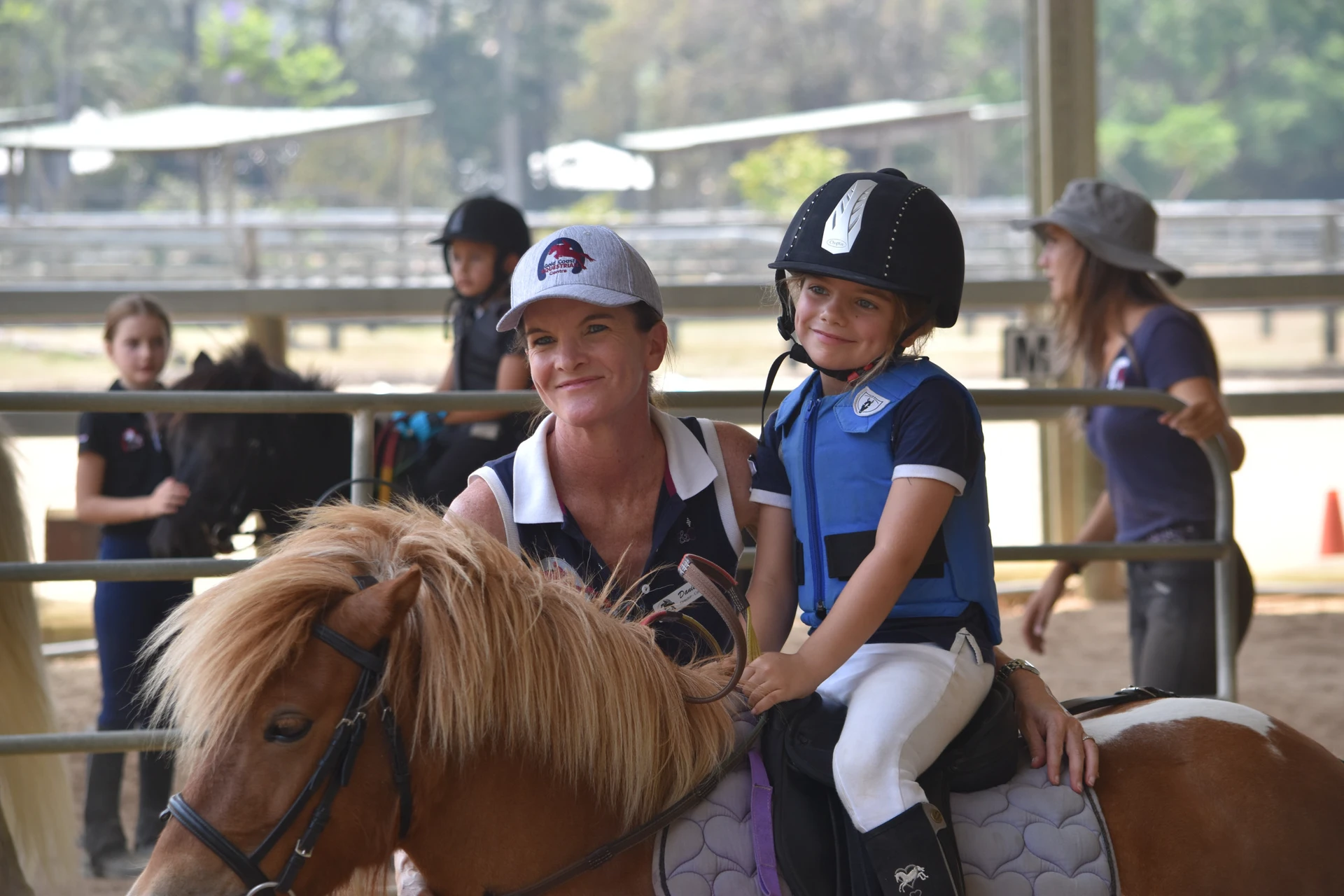 A rider clearing an oxer